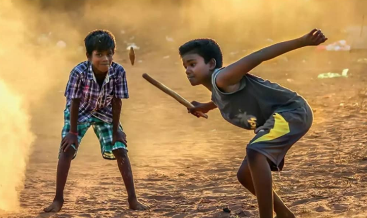 Class IV students playing traditional local games during physical education class