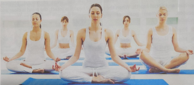 Class VI students practicing yoga poses during Health Education class