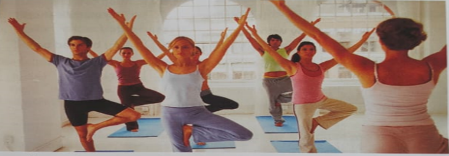 Class III students practicing basic yoga poses in a school gymnasium
