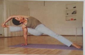 Young children performing the Tree Pose during a yoga session