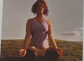 Instructor guiding students through a beginner's yoga class