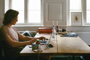 man-sitting-while-using-laptop-2825936-scaled-1.jpg